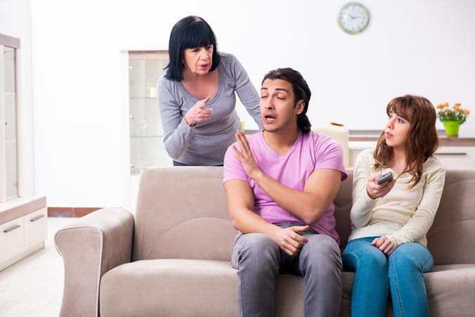 couple with mother in law arguing at home.