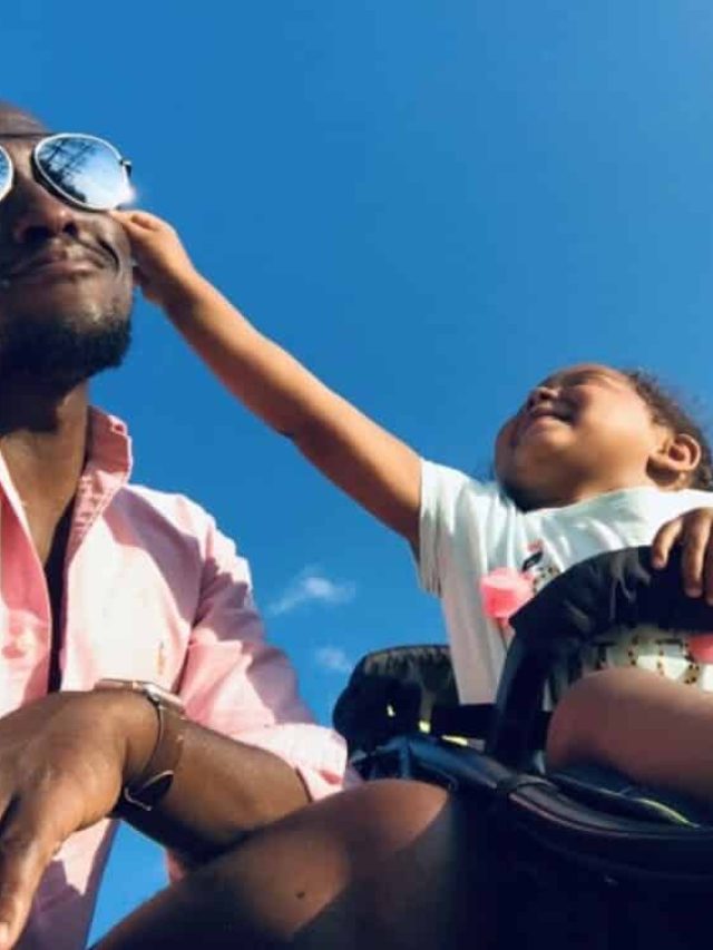 father and daughter outdoors.