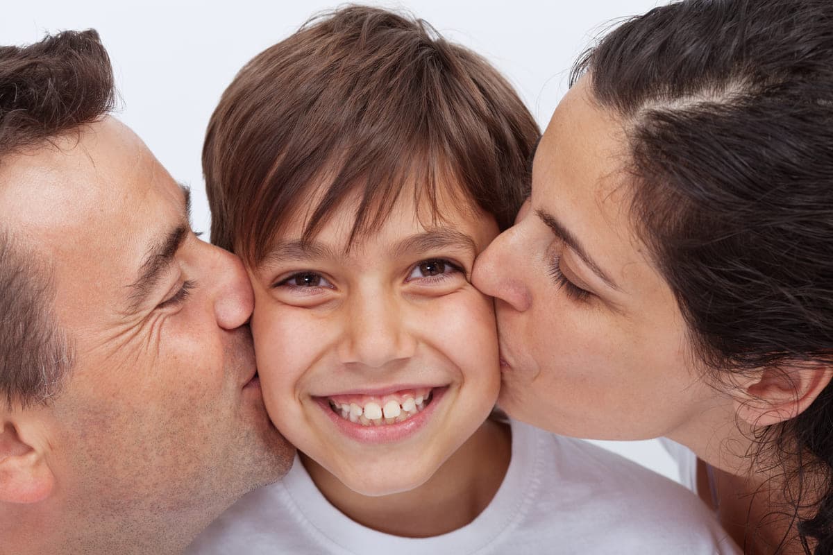 Happy kid with his parents.