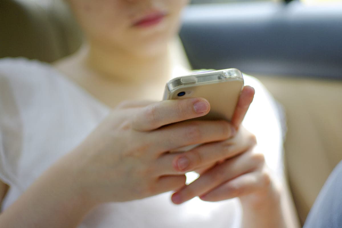 Teenager on her cell phone.