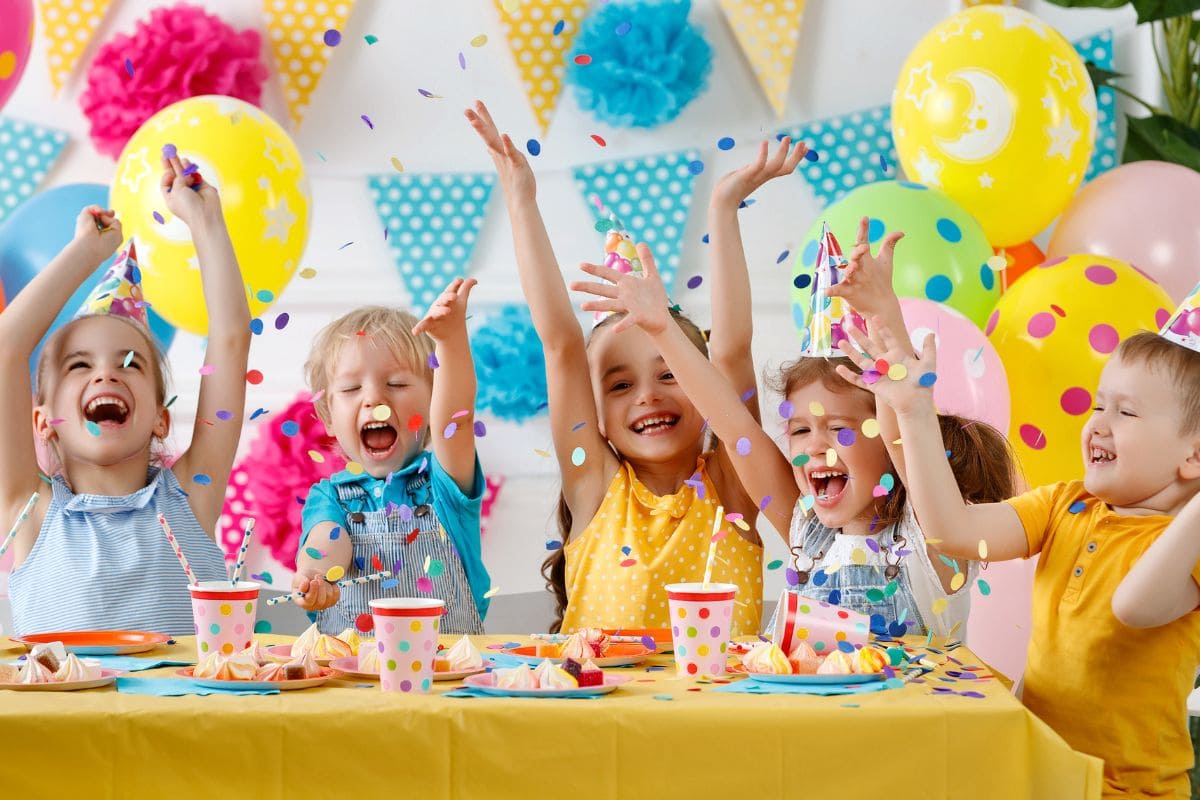 children's birthday. happy kids with cake and ballons.