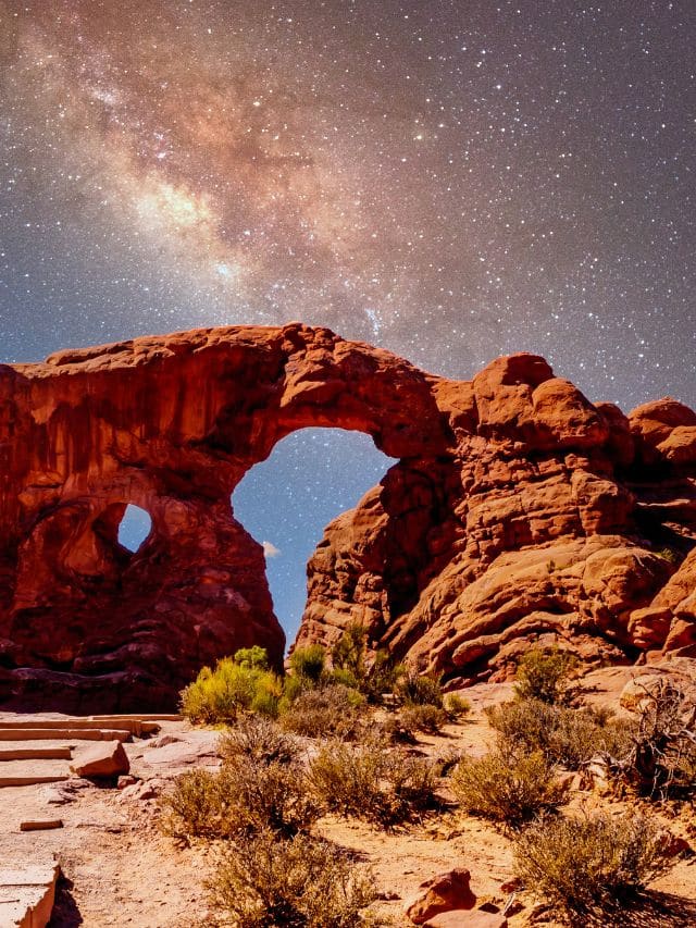 Arches National Park with starry skies at night.