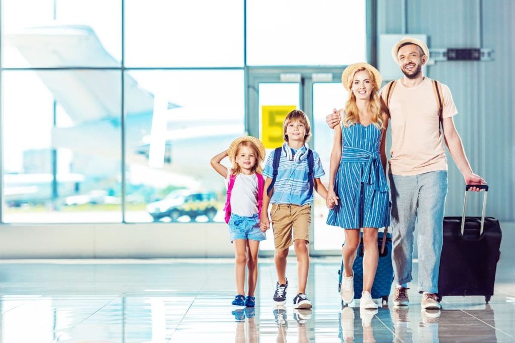 a group of family on an airport going to travel and vacation.