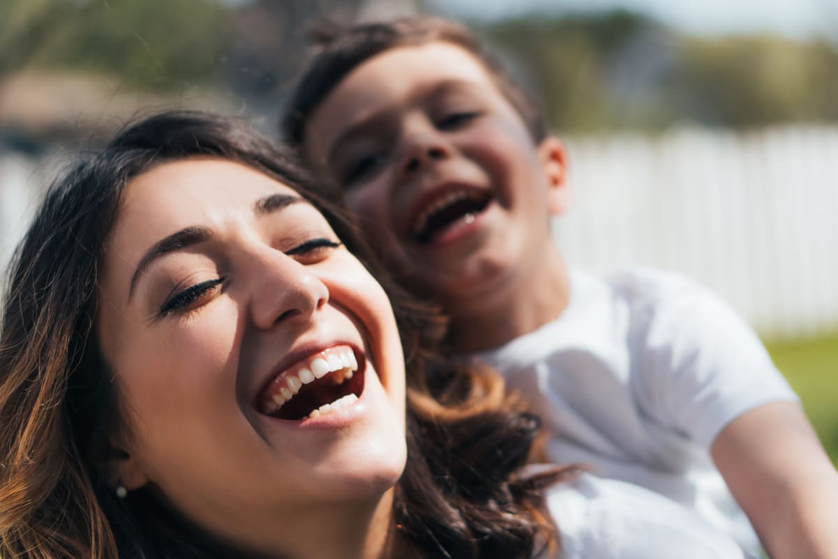 happy mother laughing with son.