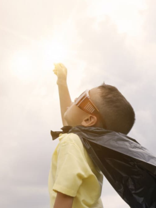 kid with superhero cape.