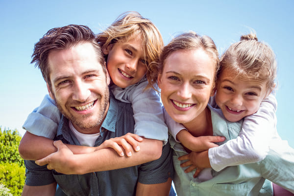 Family with kids in field