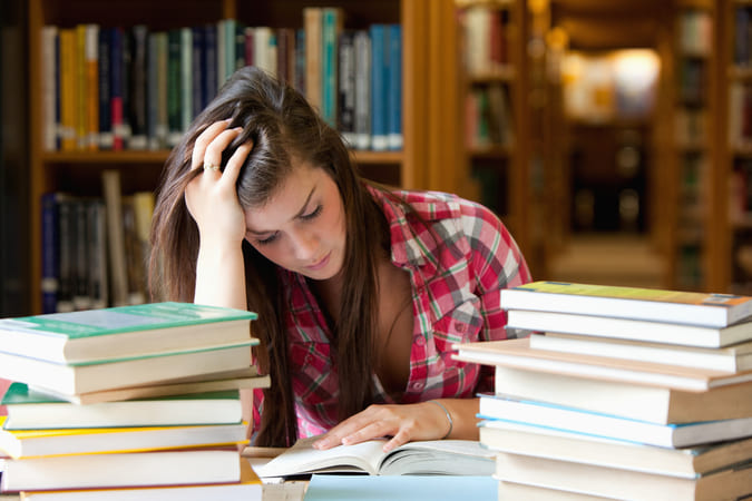 Student studying books.