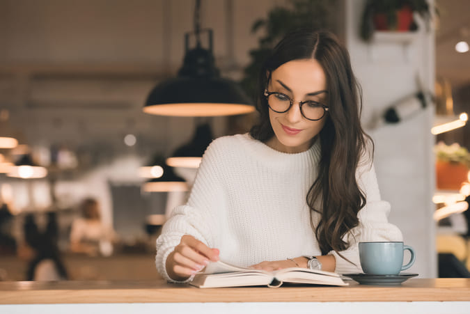 Women reading a book.