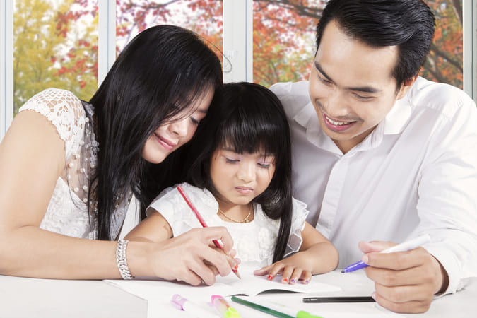 Young Asian family with daughter.