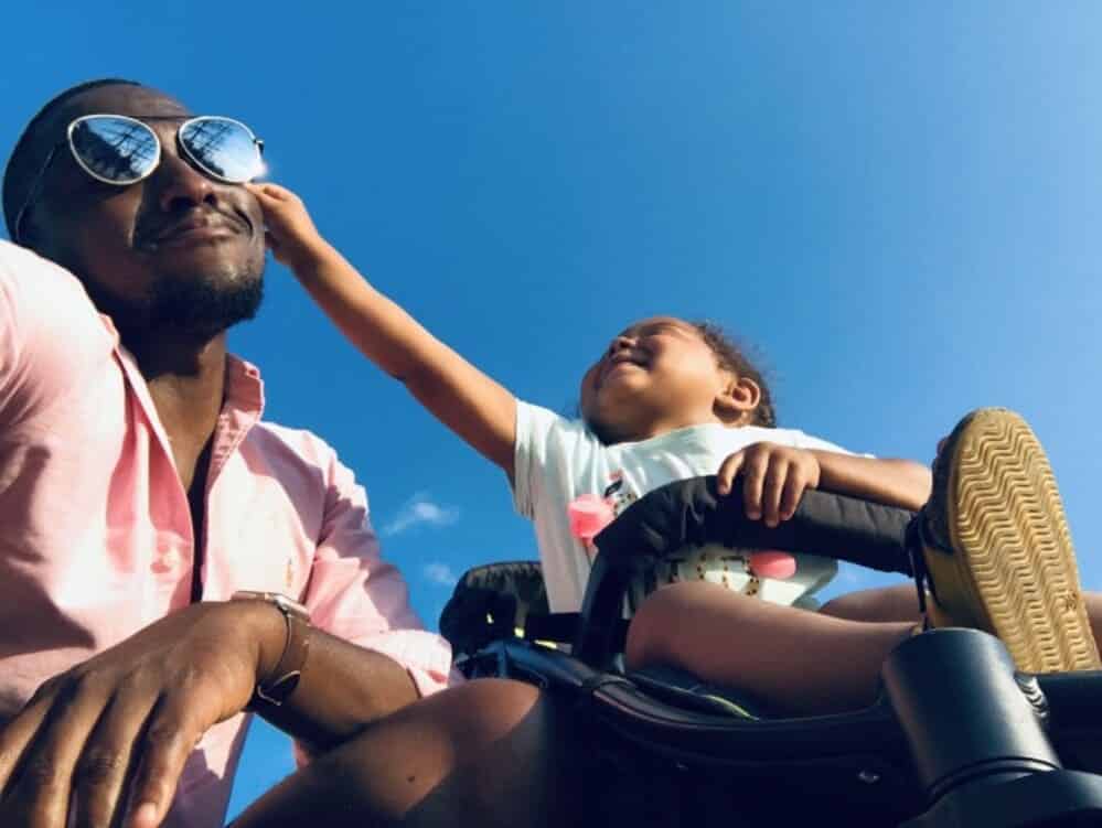 father and daughter outdoors.