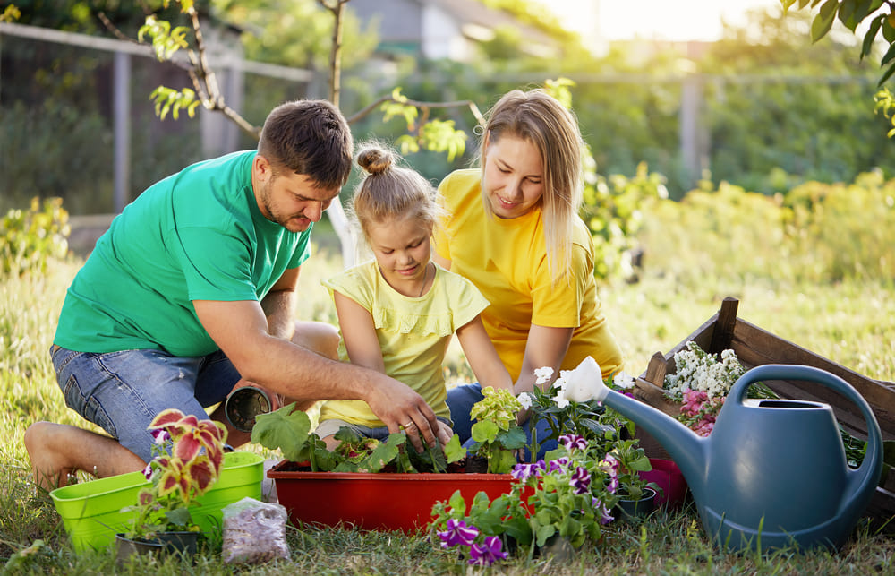 parent and kid gardening volunteer.